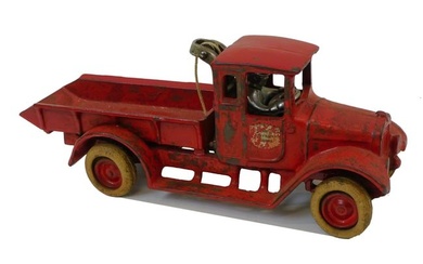 Red baby dump truck by Arcade Manufacturing Co.