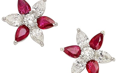 Ruby, Diamond, Platinum Earrings The flower motif earrings feature...