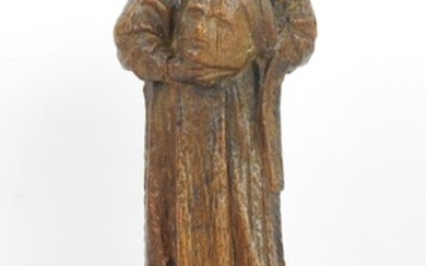 SCULPTURE en bois sculpté et trace de polychromie représentant Saint Denis. XVIII ème siècle. Haut.:...