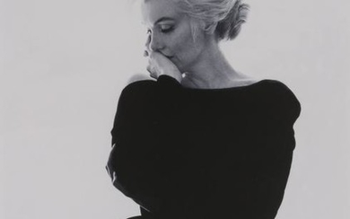 STERN, BERT (1929-2013) Marilyn Monroe looking pensive in black Dior dress