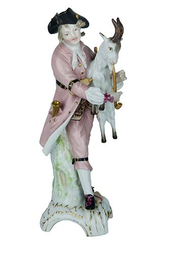 Statuette Statuette of bagpipe with goat. Porcelain painted in delicate...