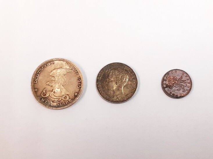 Three antique European coins: a German States, Prussia, Wilhelm II 2 mark coin, c. 1913, a Spanish Alfonso XIII 1 peseta coin, c. 1899 and a