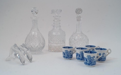 Three glass decanters and stoppers, tallest 28cm high, together with a pair of satin cushions embroidered with flowers and musical instruments; five Copeland Spode Tower pattern coffee cups; two glass leaping dolphins, largest 12.5cm long; and a...
