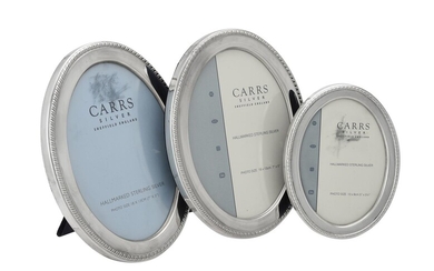 Three silver mounted oval photo frames by Carr's of Sheffield Ltd.