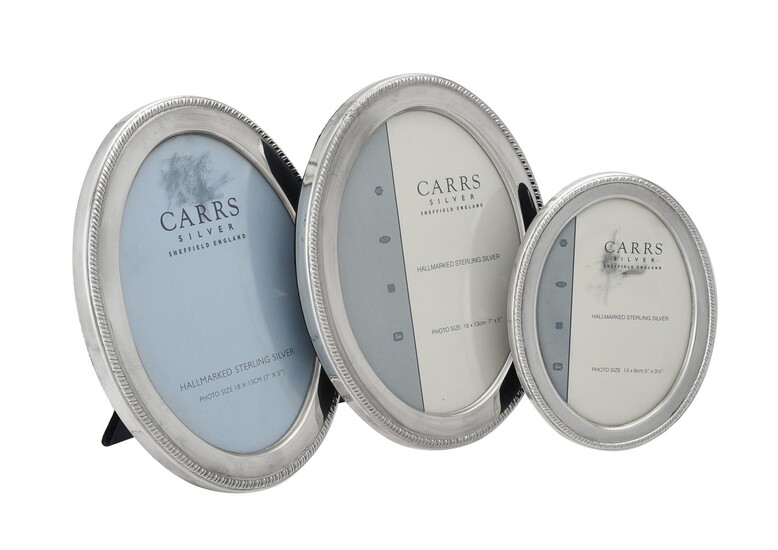 Three silver mounted oval photo frames by Carr's of Sheffield Ltd.