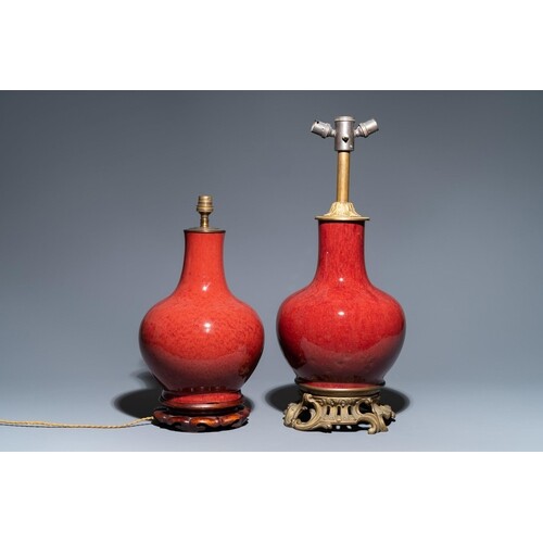 Two Chinese monochrome sang de boeuf-glazed bottle vases tra...