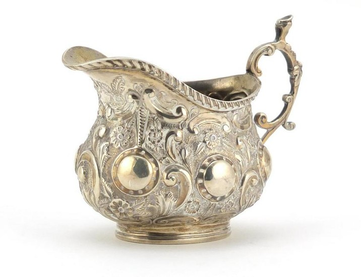 Victorian silver cream jug embossed with flowers