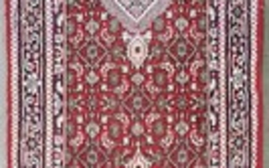 Woollen Persian Runner on red ground with blue boarder (W:83cm)