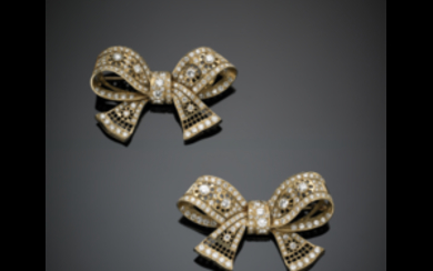 Two yellow gold diamond openwork ribbon brooches, in all...