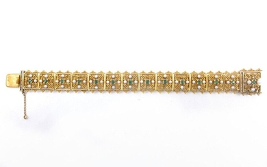 18th C. BRACELET in 18K yellow gold composed of a succession of square geometrical patterns retaining an emerald and four white pearls (untested) (missing 8 pearls). Length: 21 cm. Gross weight : 54.26 gr. A gold, emerald and pearl bracelet.