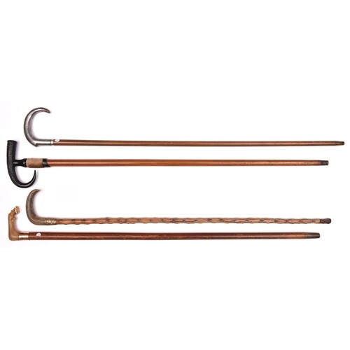 4 walking sticks: malacca, the pale horn handle terminating ...