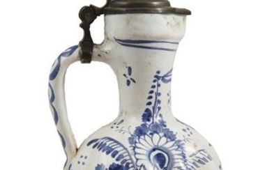 63- Germany : earthenware "torsos" pitcher with blue monochrome decoration...