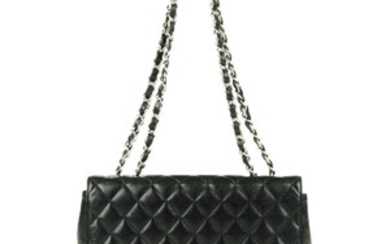 CHANEL - a Jumbo Caviar Classic Flap handbag. View more details