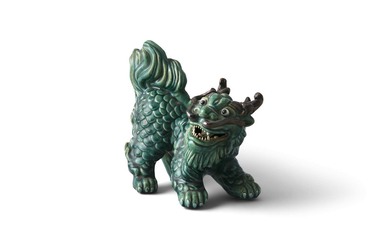 A CHINESE GREEN GLAZED MODEL...