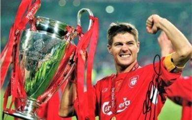 Football Steve Gerrard 12x16 signed colour photo pictured celebrating with the Champions League Trophy. Good Condition. All...