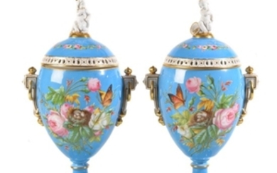 A pair of French porcelain turquois-ground ovoid pedestal pot-pourri vases and covers