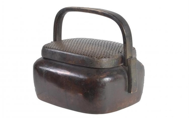 A rare large Chinese copper hand warmer and cover