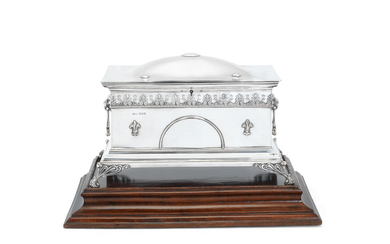 A silver casket and stand