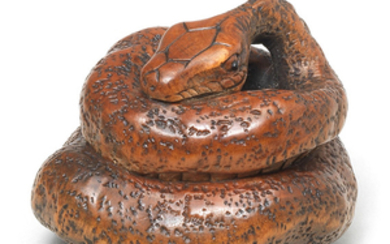 A wood netsuke of a snake