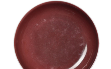 A COPPER-RED-GLAZED DISH, QIANLONG SIX-CHARACTER SEAL MARK IN UNDERGLAZE BLUE AND OF THE PERIOD (1736-1795)