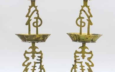 PAIR OF CHINESE BRASS CANDLESTICKS Openwork calligraphy stems with lozenge-form drip cups. Footed bases. Heights 16".
