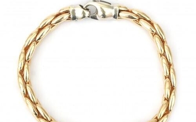 A 14 karat two tone gold rope link bracelet. Composed of a yellow gold rope link to a white gold lobster clasp. Gross weight: 17.7 g.