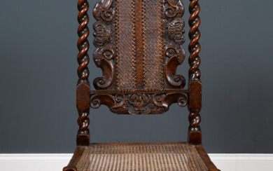 A 17th century walnut high backed side chair