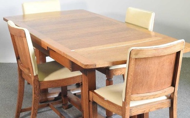 A 1930's light oak draw leaf dining table, together with...