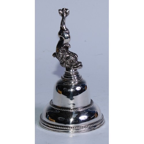 A 19th century Dutch silver table bell, dolphin handle, bead...
