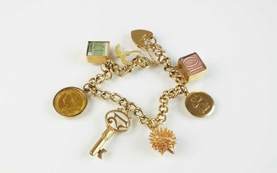 A 9ct gold curb link bracelet with attached charms