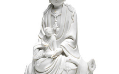 A BLANC DE CHINE FIGURE OF GUANYIN AND CHILD