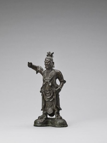A BRONZE FIGURE OF A TEMPLE GUARDIAN, MING...