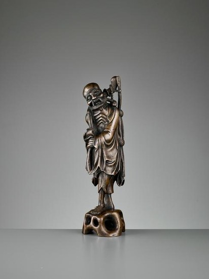A BRONZE OF AN EMACIATED IMMORTAL, 17TH CENTURY