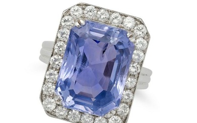 A CEYLON NO HEAT SAPPHIRE AND DIAMOND RING in platinum, set with an octagonal step cut sapphire o...