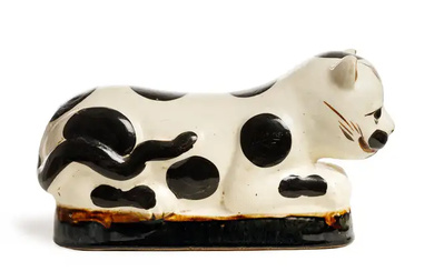 A Chinese Cizhou-type figural 'cat' pillow Early 20th century Mounded in the...