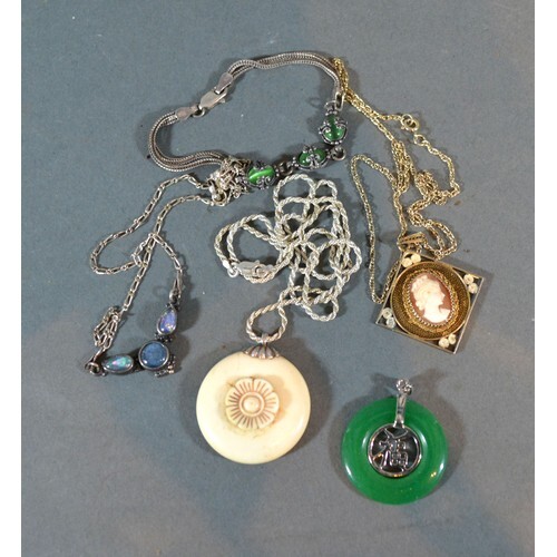 A Chinese Jade Set Pendant together with two other necklaces...