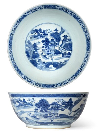 A Chinese Porcelain Punch Bowl, early 19th century, painted in underglaze blue with river...