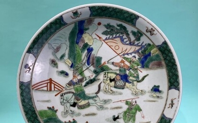 A Chinese famille verte porcelain plate handpainted with warriors...