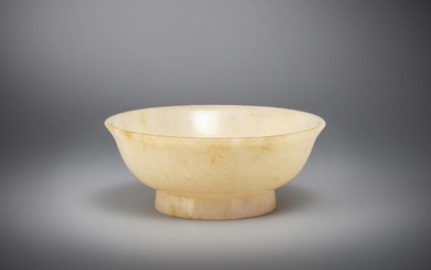A Chinese small pale celadon and russet jade bowl