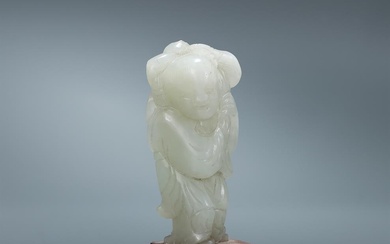A Chinese white jade figure of a boy