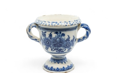 A FRENCH FAIENCE TWIN HANDLED FLOWER POT Early 18th century,...