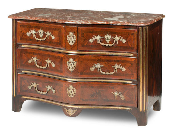 A French Régence walnut, brass-mounted and crossbanded commode, early 18th century