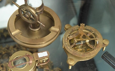 A GROUP OF THREE BRASS COMPASSES