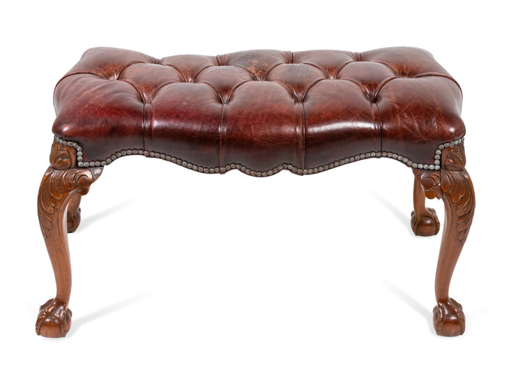 A George III Style Carved Mahogany Tufted-Leather Ottoman
