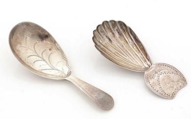 A George III silver caddy spoon; and another caddy spoon.