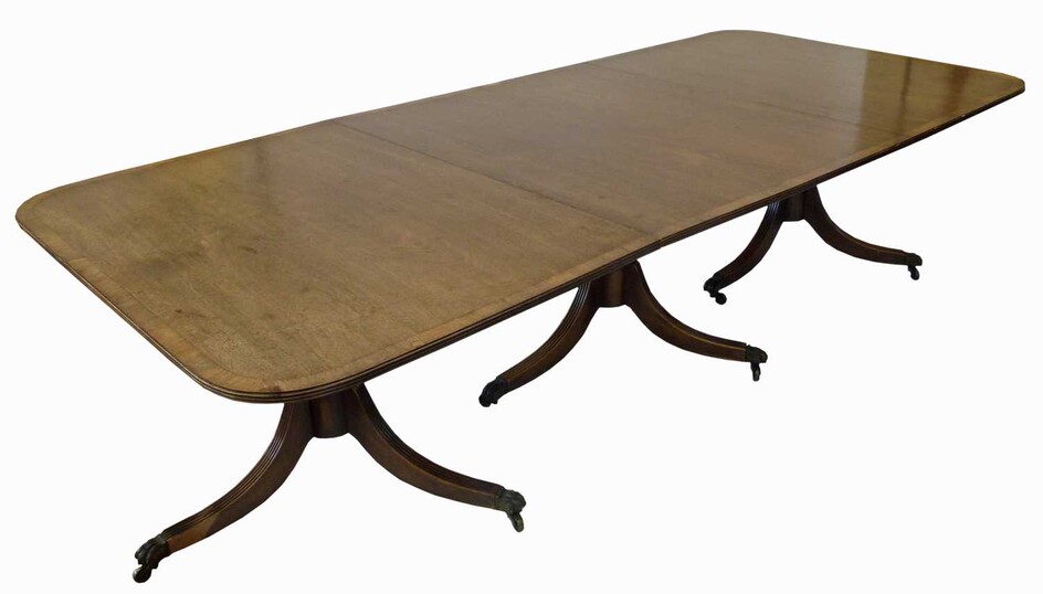 A George III style mahogany three-pillar dining table