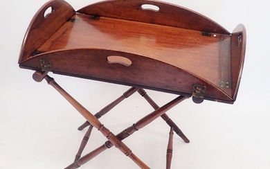 A Georgian mahogany butlers tray on turned wood stand