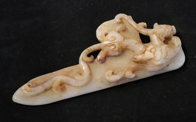 A HETIAN JADE PENDANT CARVED WITH BEAST PATTERN