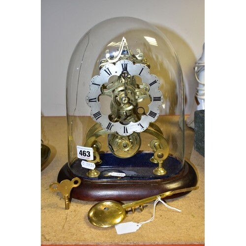 A LATE VICTORIAN BRASS SKELETON CLOCK UNDER A GLASS DOME, th...