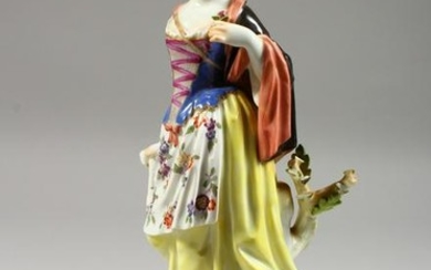 A MEISSEN FIGURE OF A LADY, standing holding a posy, a